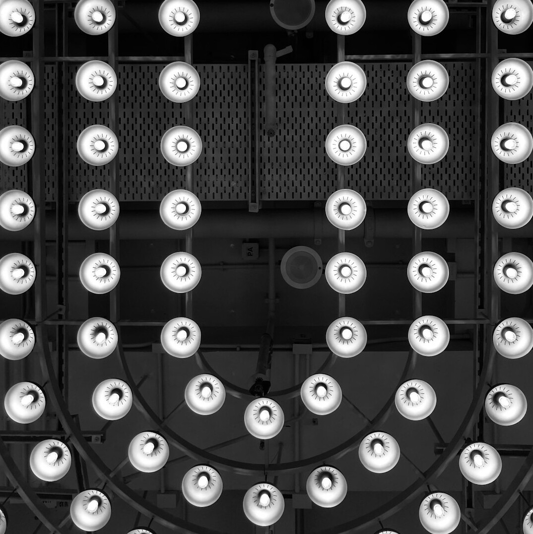 Studio lighting rig with softboxes and spotlights